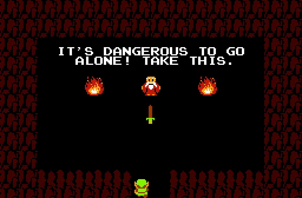 Screenshot from the 1986 video game The Legend of Zelda. An old man is depicted saying: “It’s dangerous to go alone! Take this.”, and we can see a sword in the middle of the screen.